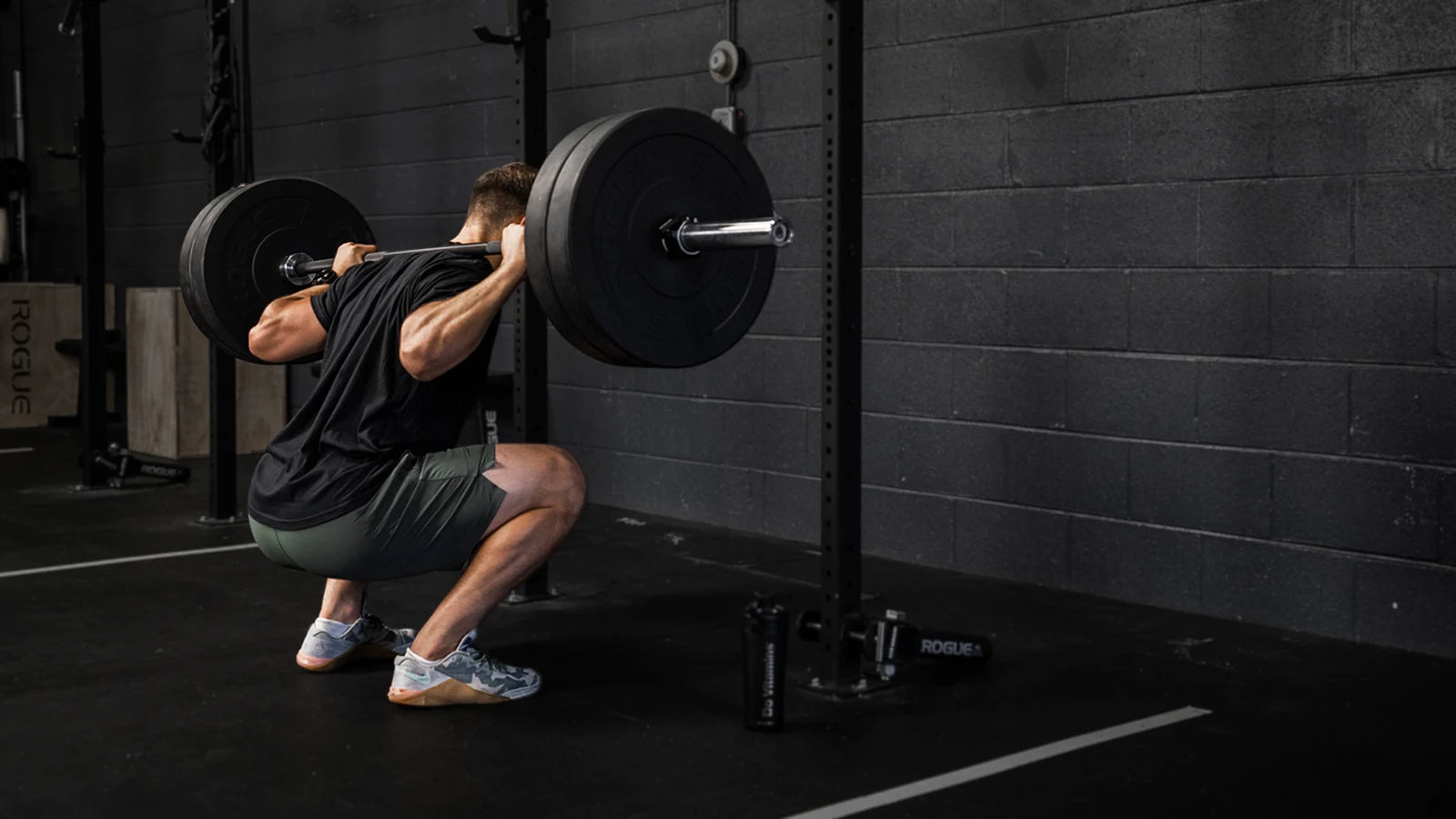 An athlete performing a barbell squat